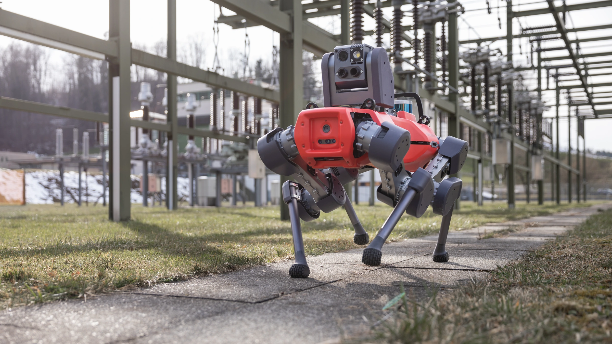 A red ANYmal D inspection robot in a substation, in a 2021 archive photograph; not the Whitegate door-access trial.