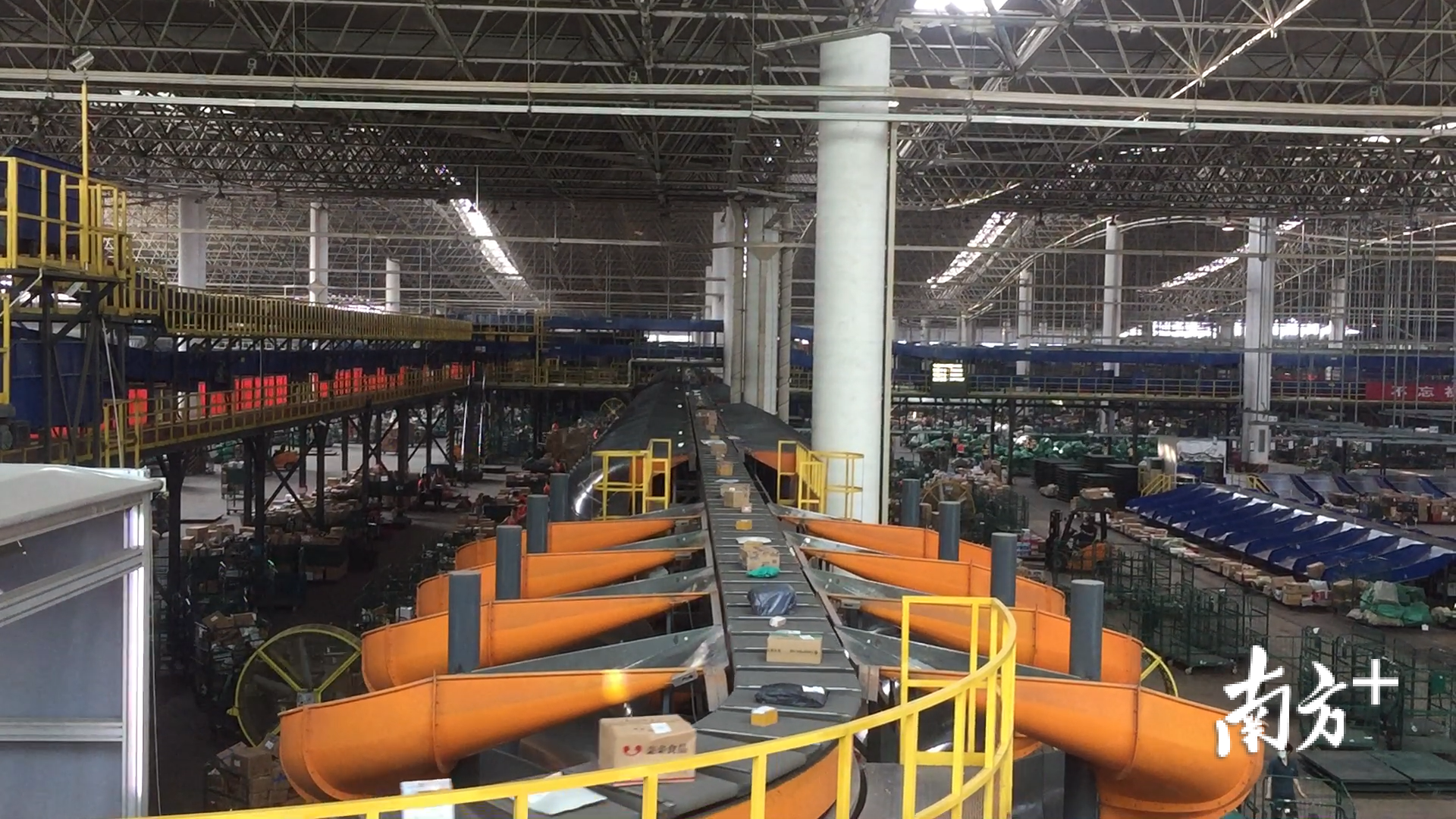 A double-layer parcel sorting conveyor inside China Post’s Jianggao mail center in Guangzhou