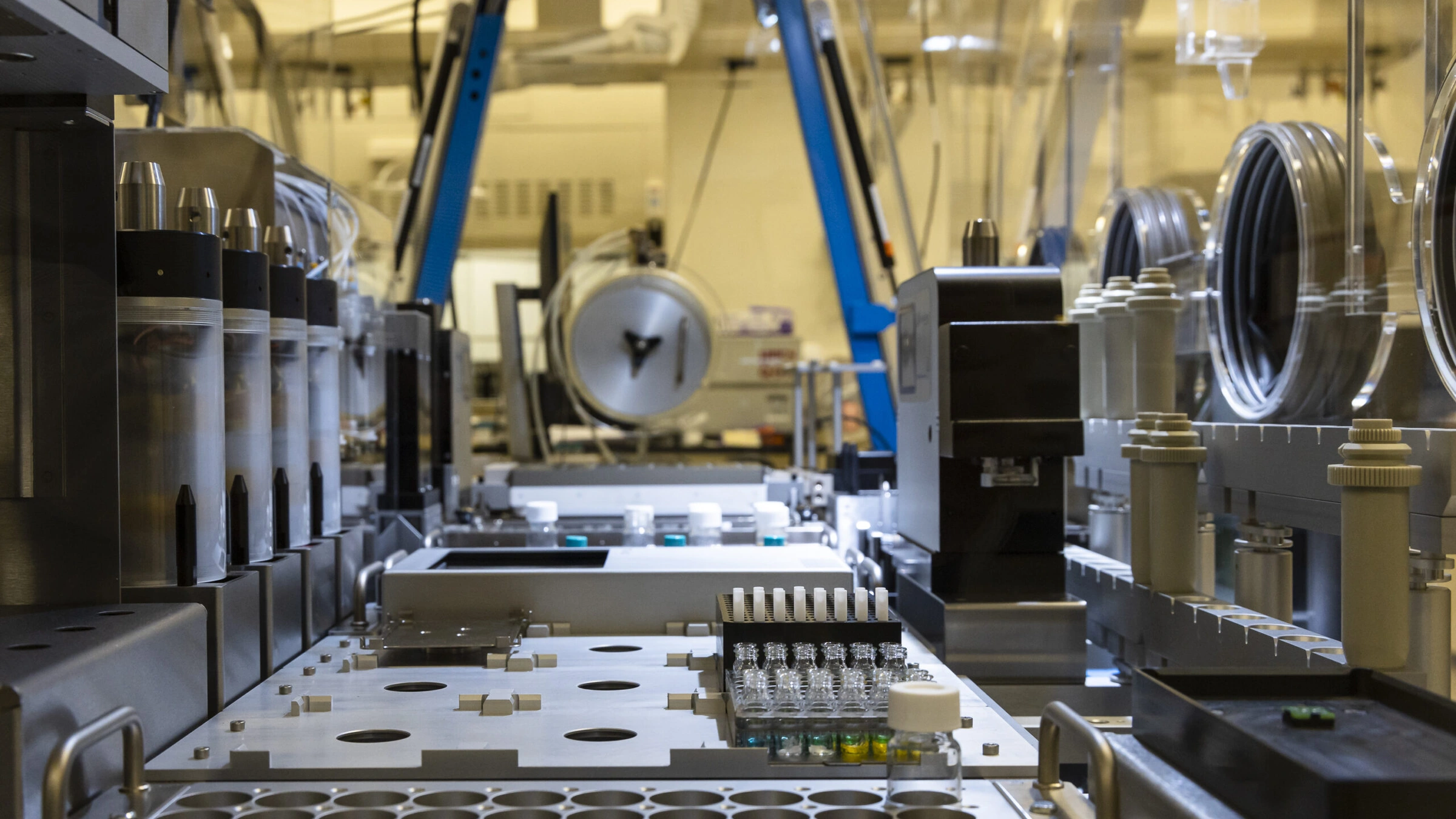 Sample racks and automated equipment in ORNL’s INTERSECT chemistry lab, pictured in a February 2023 report; archival context for TRACE.