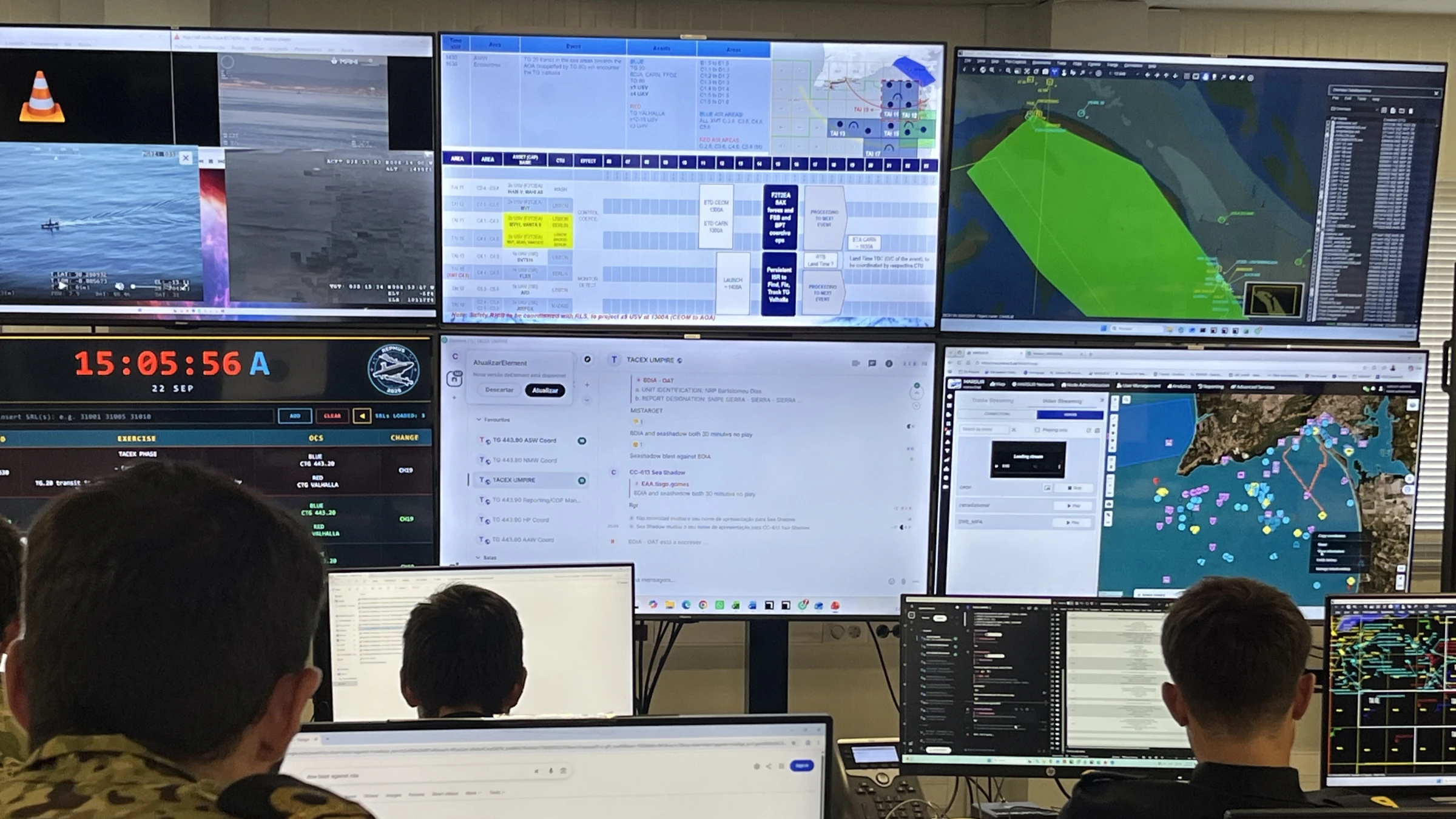 Operators face a wall of maritime monitoring screens in a REPMUS control room; one screen carries 2024 exercise branding.