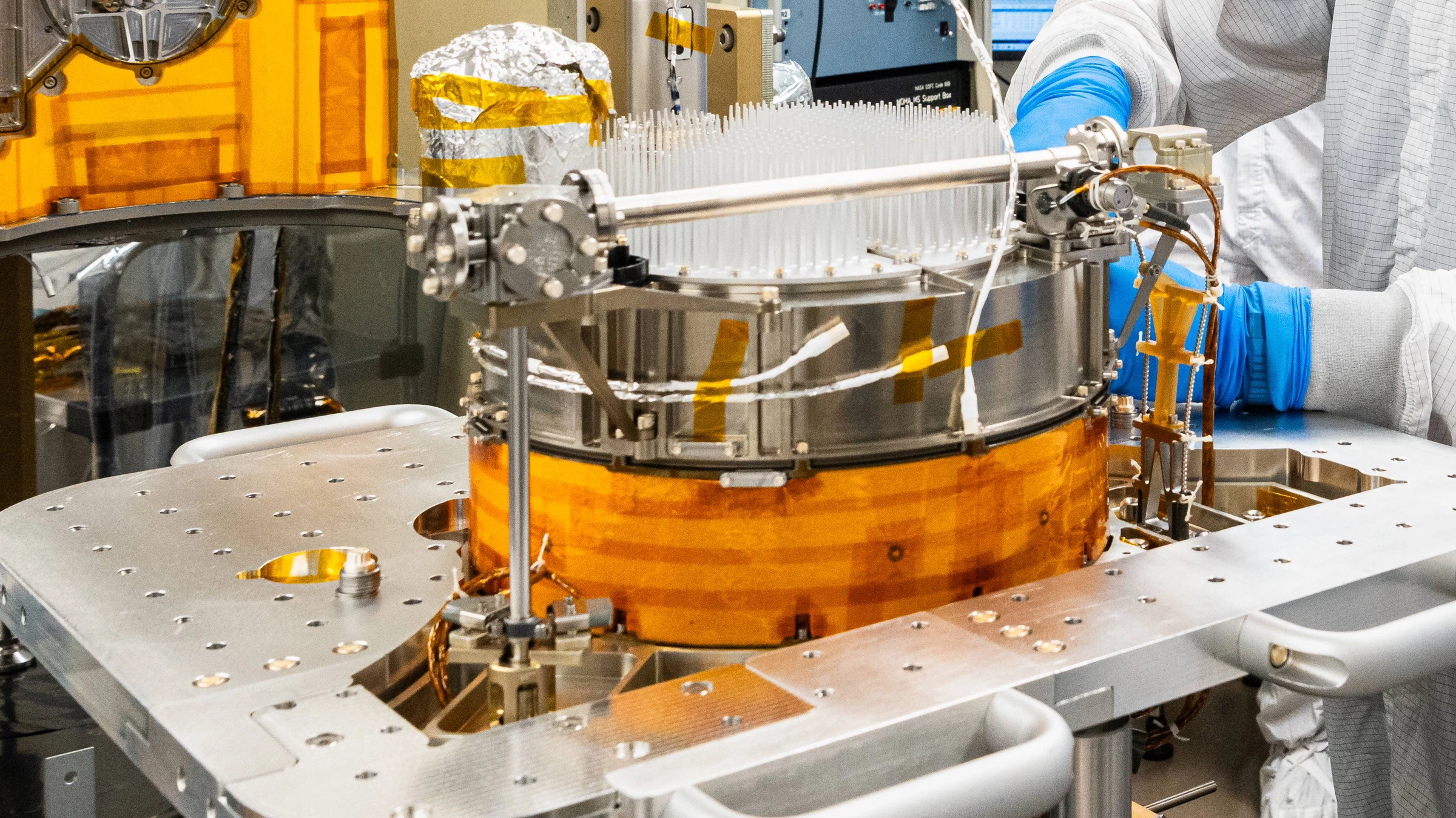 Dragonfly sampling hardware during assembly at NASA Goddard on 6 March 2026. Archive photograph of a sample carousel, not a nuclear power unit or the October agreement.