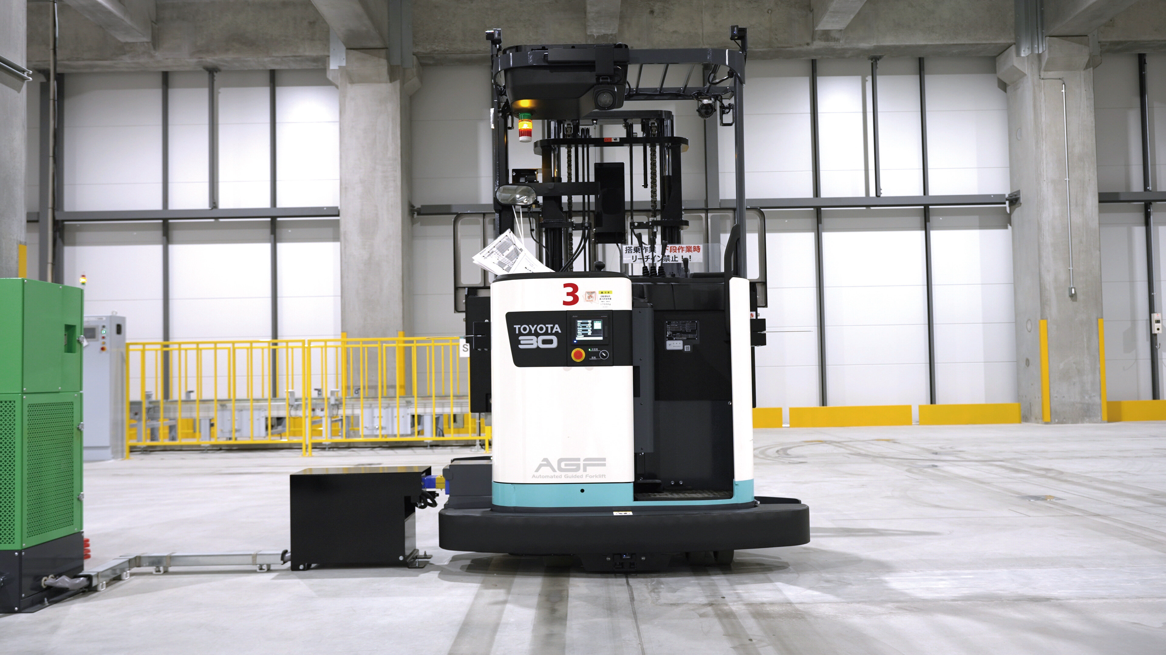 A Toyota AGF automated guided forklift operates inside Suntory Logistics’ Urawa-Misono distribution center.