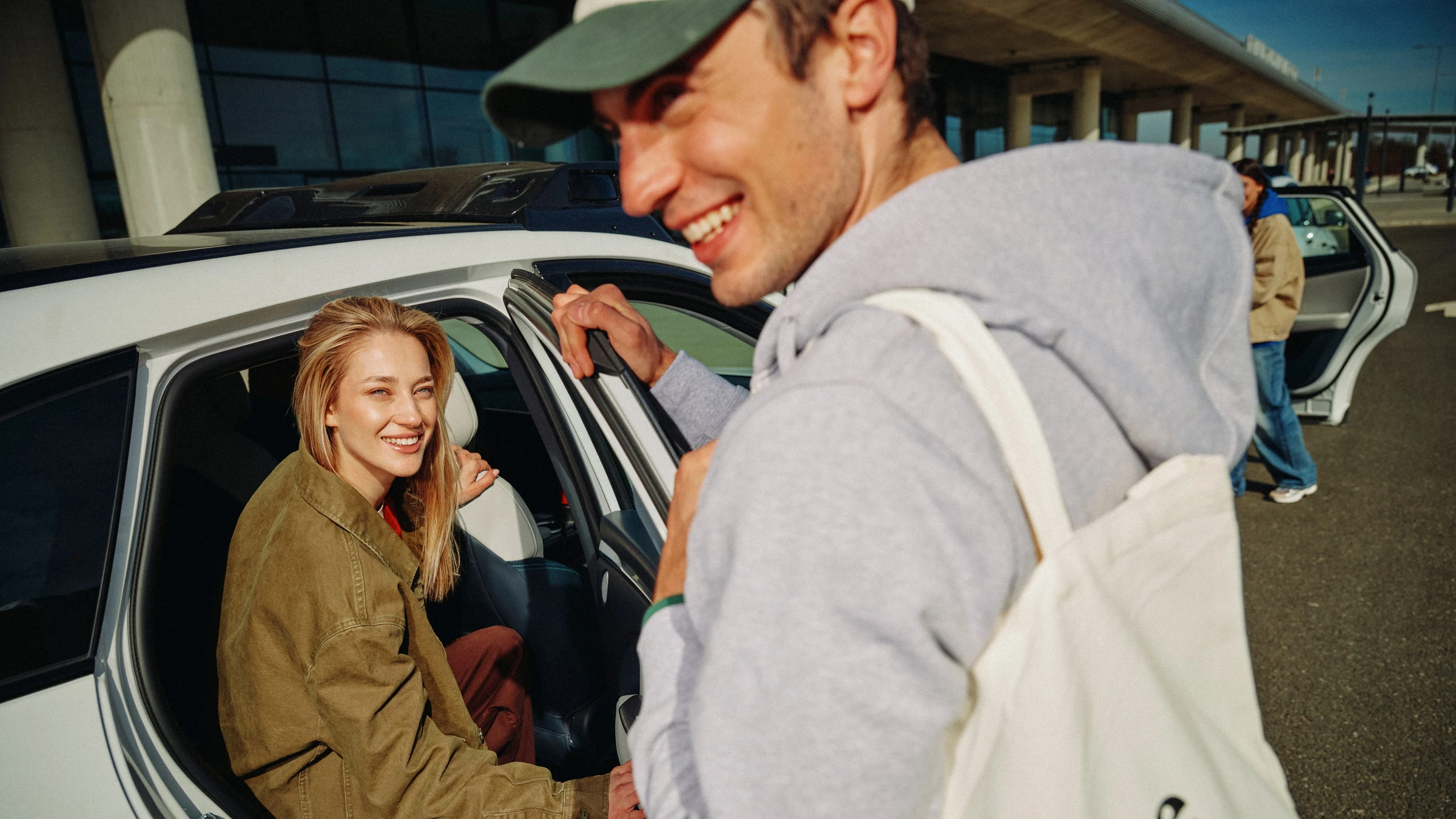 People beside an open rear door of a white Verne robotaxi in a company-supplied Zagreb press photograph.